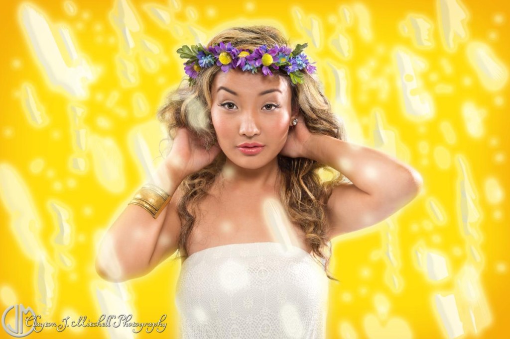 model on photoshopped glowing yellow background