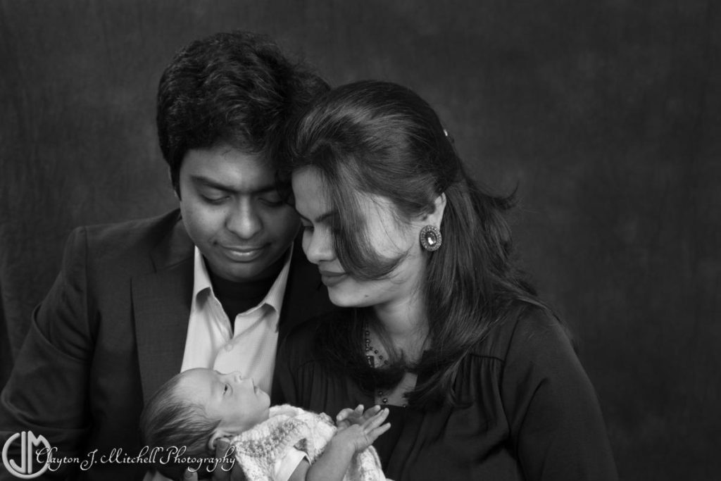 black and white family photo with newborn