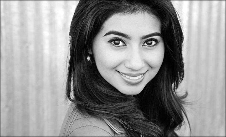 Black and White Senior Portrait with Corrugated Iron Background