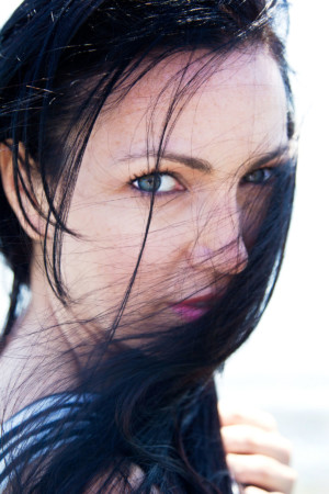 Fashion head shot with hair in face