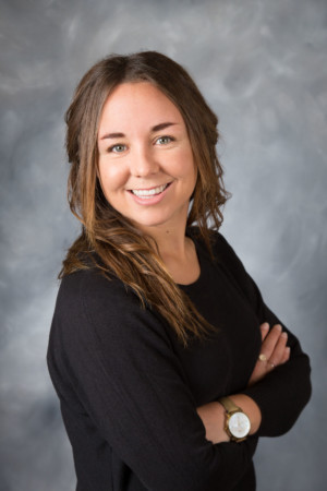 Realtor on mottled gray head shot