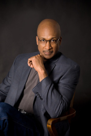 Sophisticated fellow in a chair with black background