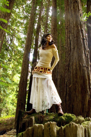 Dramatic model on stump in Redwoods