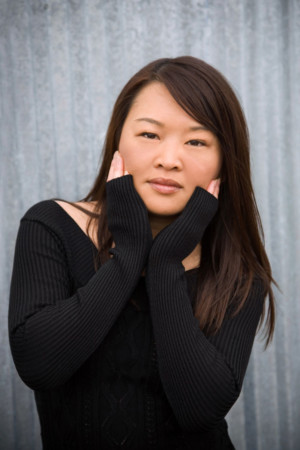 Stylish woman with hands on face