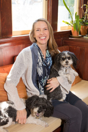 Woman at home with her dogs