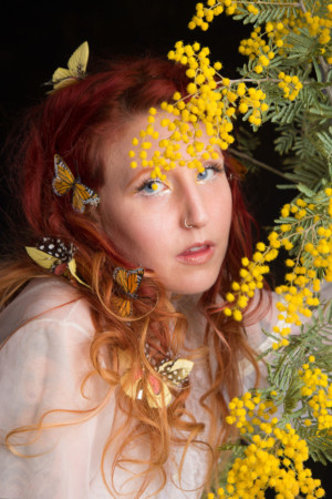 Mimosa blossom girl with butterflies