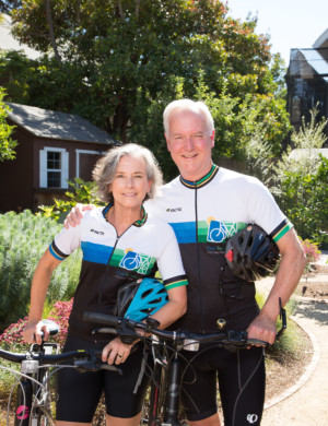 Older couple wearing cycling outfits