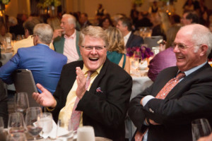 Businessman laughing at a fundraiser