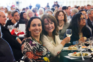 Two women toast at Alameda Chamber event