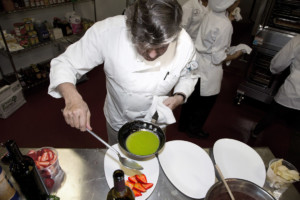 Chef pours glaze on strawberries