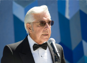 Man in tux in Blue background